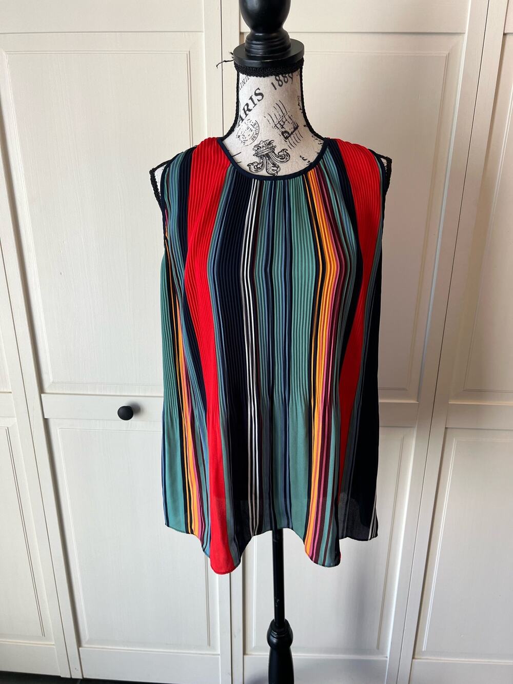Dalia multi colored striped peplum hem tank top blouse